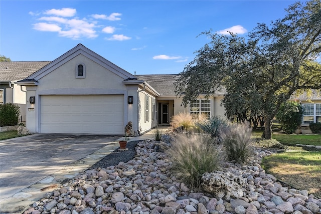 ranch-style house featuring a garage