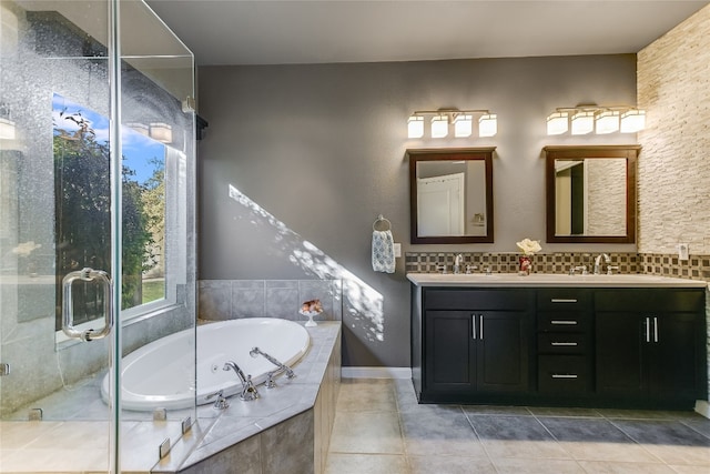 bathroom with tile patterned flooring, vanity, and separate shower and tub