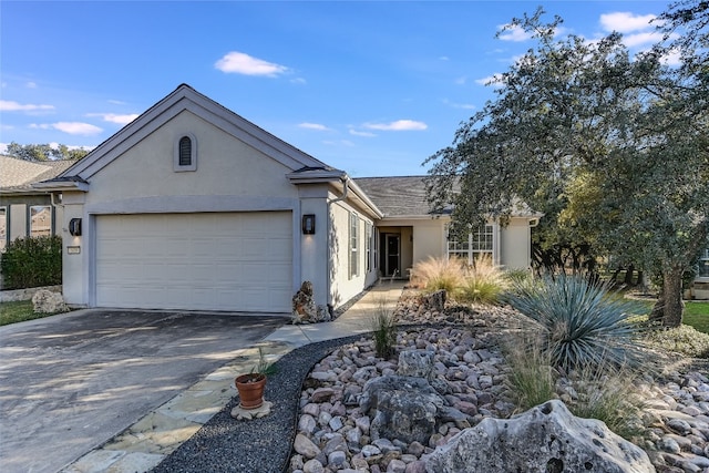 ranch-style home featuring a garage