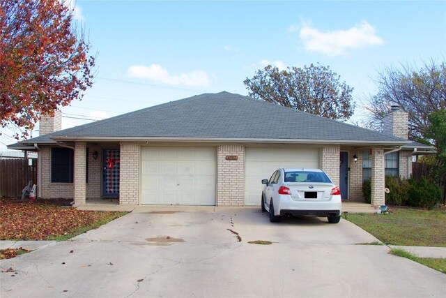 single story home with a garage