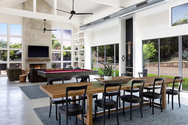 interior space featuring ceiling fan, a fireplace, and pool table