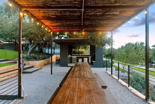 patio terrace at dusk with an outdoor bar