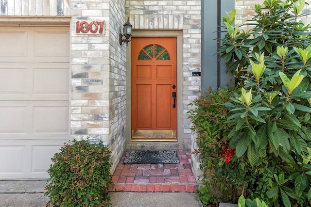 1807 Iris Ln, Cedar Park, TX 78613 - property entrance with a garage, brick siding, and stone siding