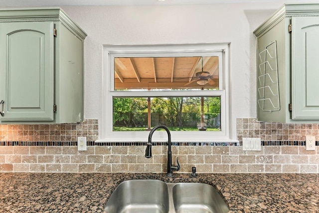 1807 Iris Ln, Cedar Park, TX 78613 - kitchen featuring a sink, green cabinets, decorative backsplash, and ceiling fan