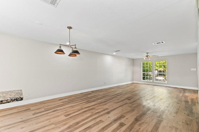1807 Iris Ln, Cedar Park, TX 78613 - unfurnished room with wood finished floors, ceiling fan, and baseboards