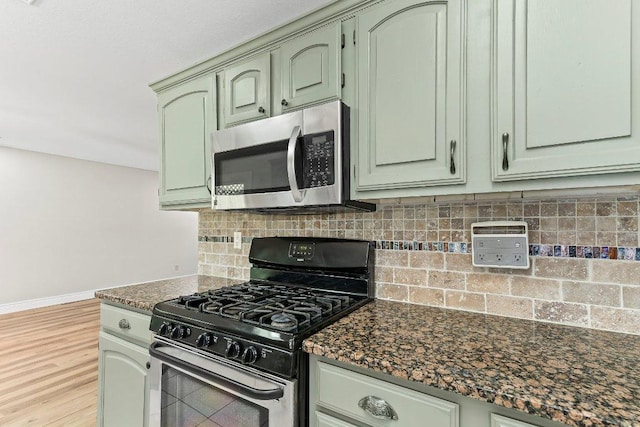 1807 Iris Ln, Cedar Park, TX 78613 - kitchen featuring gas stove, stainless steel microwave, tasteful backsplash, and green cabinets