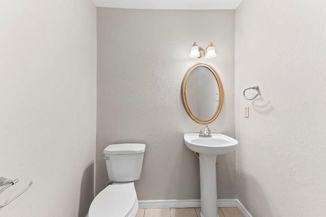 1807 Iris Ln, Cedar Park, TX 78613 - half bathroom with toilet, tile patterned floors, baseboards, and a sink