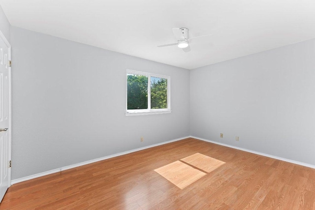 1807 Iris Ln, Cedar Park, TX 78613 - empty room with wood finished floors, a ceiling fan, and baseboards