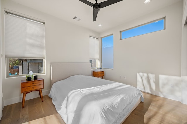 bedroom featuring light hardwood / wood-style flooring and ceiling fan