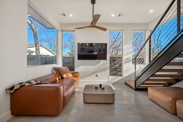 interior space with ceiling fan