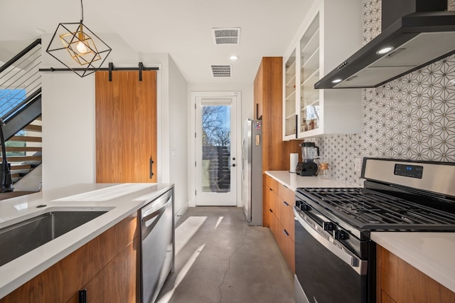 409 W Odell St Unit 2, Austin, TX 78752 - kitchen featuring stainless steel appliances, wall chimney exhaust hood, concrete floors, brown cabinetry, and recessed lighting