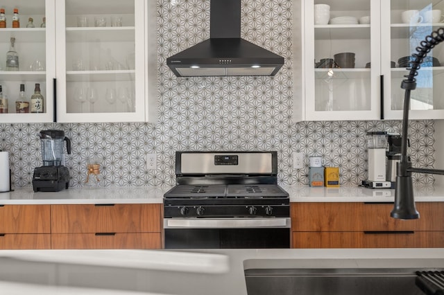 409 W Odell St Unit 2, Austin, TX 78752 - kitchen featuring wall chimney range hood, stainless steel range with gas stovetop, and modern cabinets