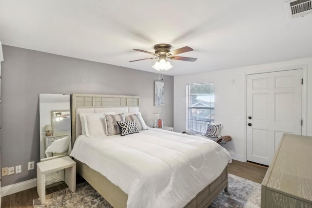 bedroom featuring ceiling fan and dark wood-type flooring