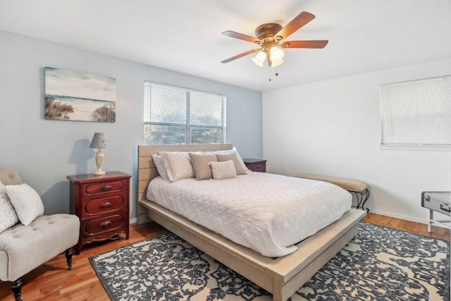 bedroom featuring light wood-style flooring and a ceiling fan