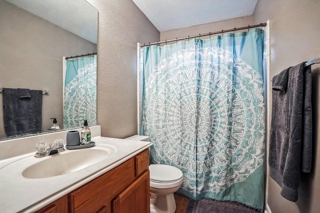 bathroom featuring a shower with shower curtain, vanity, and toilet