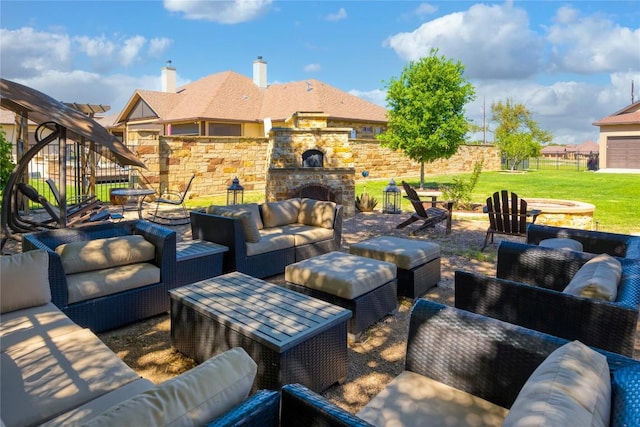 view of patio with an outdoor living space with a fireplace and fence