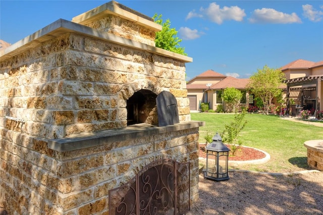 exterior space with an outdoor stone fireplace