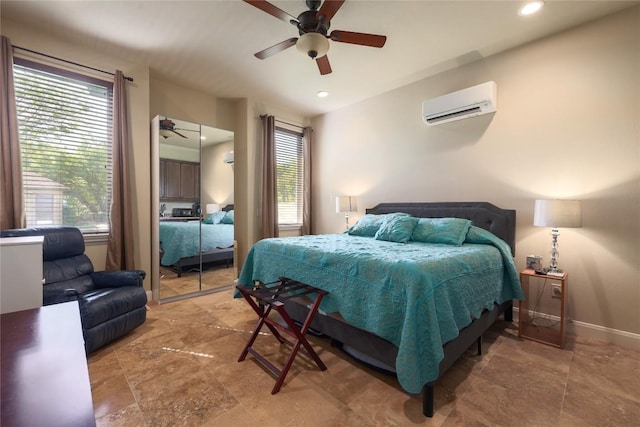 bedroom featuring ceiling fan, a wall mounted AC, recessed lighting, and baseboards