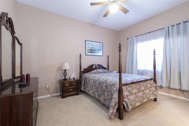 bedroom with light colored carpet and ceiling fan