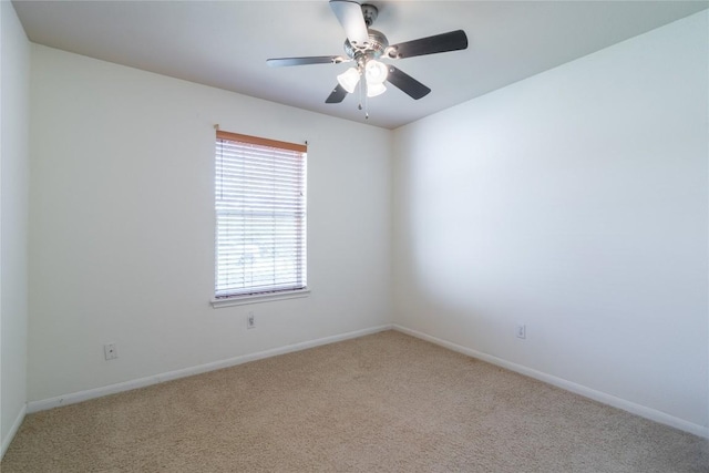 unfurnished room featuring ceiling fan and light carpet