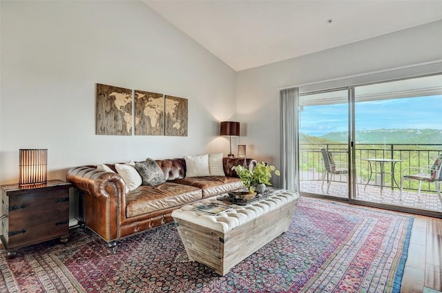 living room with high vaulted ceiling