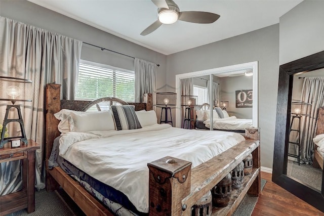 bedroom with ceiling fan and dark wood-type flooring