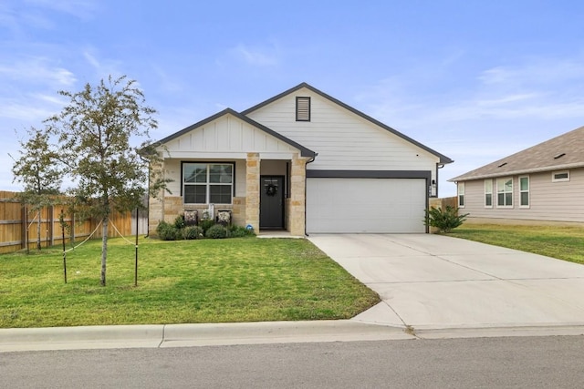 view of front of home featuring a garage and a front lawn