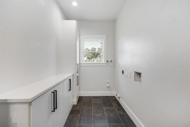 clothes washing area with hookup for a washing machine, hookup for a gas dryer, and electric dryer hookup