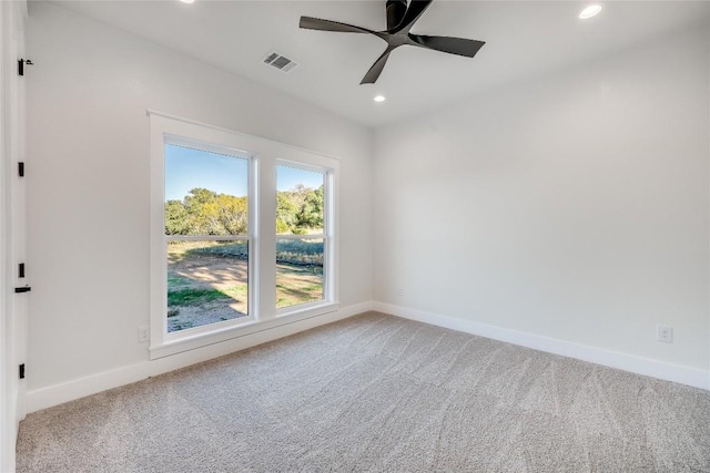 unfurnished room with carpet floors and ceiling fan