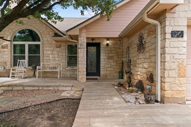 view of exterior entry featuring a porch