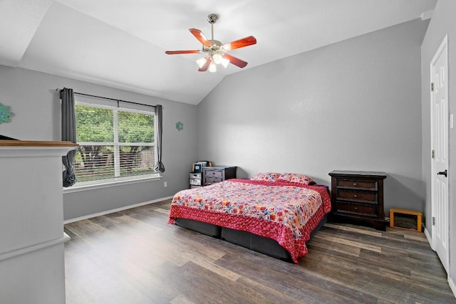 bedroom featuring vaulted ceiling, ceiling fan, and dark wood-type flooring