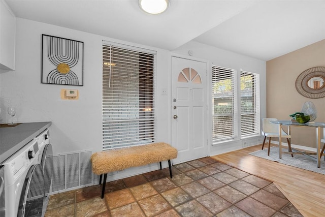 entrance foyer featuring washer / dryer