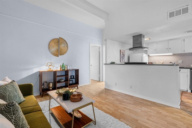 living room with light hardwood / wood-style floors