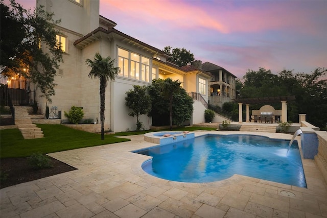 2005 Far Gallant Dr, Austin, TX 78746 - pool at dusk with stairway, a pool with connected hot tub, and a patio area