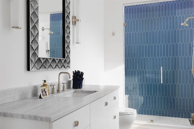 2005 Far Gallant Dr, Austin, TX 78746 - bathroom featuring vanity, toilet, and a tile shower