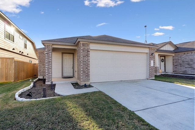 ranch-style house featuring a garage and a front lawn