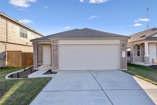 view of front of property with a front yard and a garage