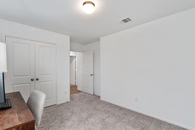 home office with light colored carpet