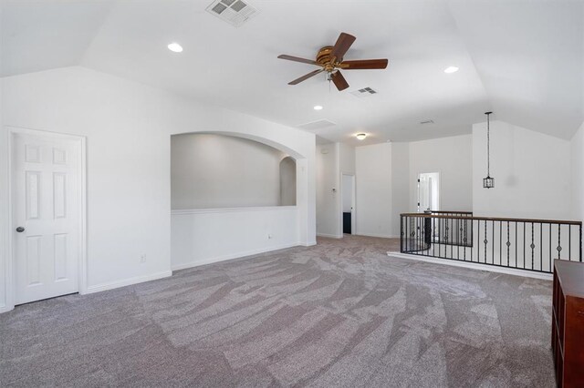 unfurnished room featuring carpet floors, ceiling fan, and lofted ceiling