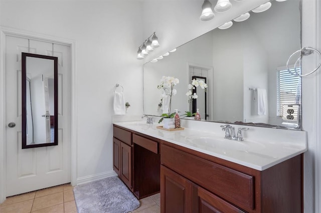 bathroom with tile patterned flooring and vanity