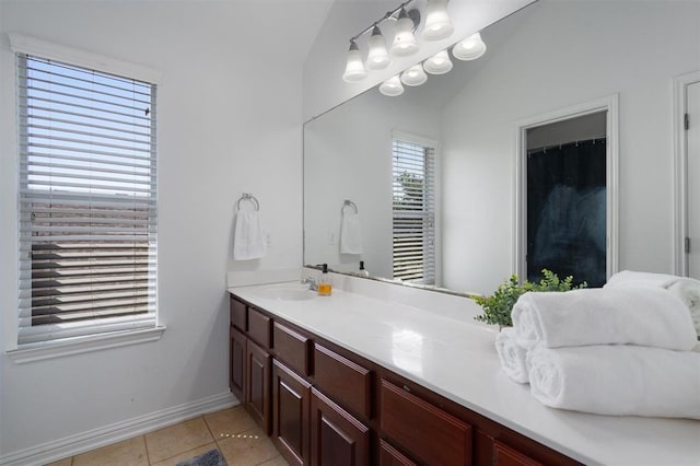 bathroom featuring tile patterned flooring and vanity