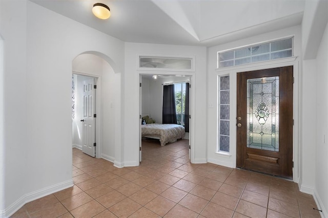 foyer entrance with light tile patterned flooring