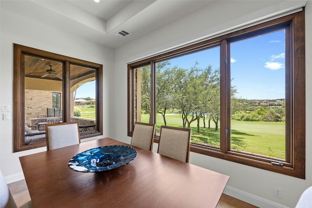 dining room with a healthy amount of sunlight, visible vents, and baseboards