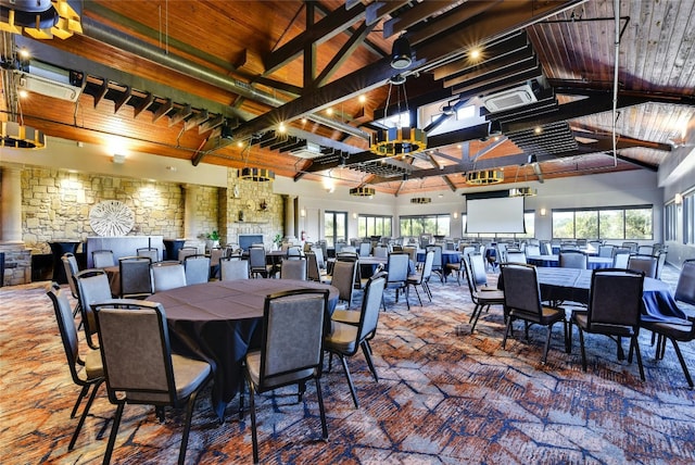 dining space featuring high vaulted ceiling, wooden ceiling, and beam ceiling