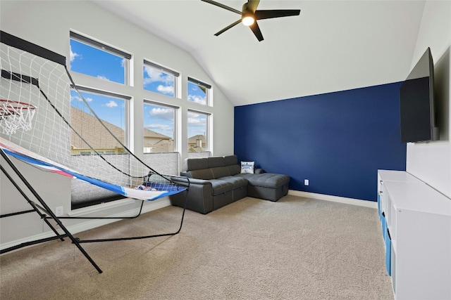 unfurnished living room with ceiling fan, vaulted ceiling, and light carpet