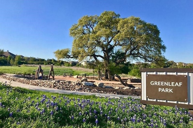 community / neighborhood sign featuring a rural view