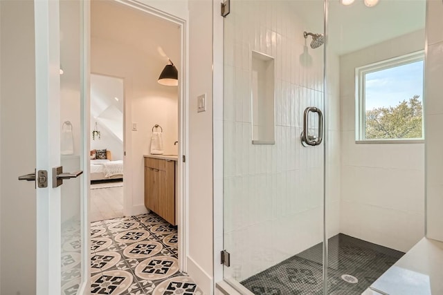 bathroom featuring tile patterned flooring and a shower with shower door