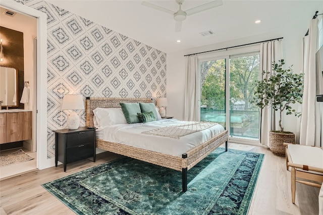 bedroom featuring access to outside, ceiling fan, and light wood-type flooring