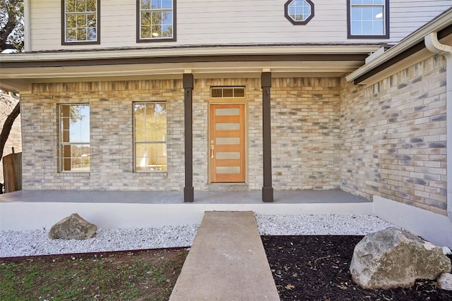 entrance to property featuring covered porch