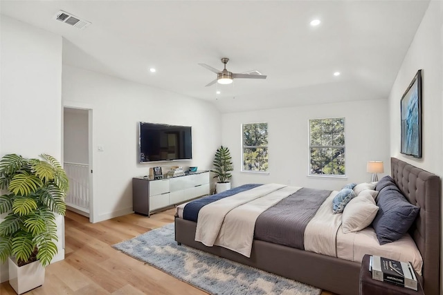 bedroom featuring light hardwood / wood-style flooring and ceiling fan